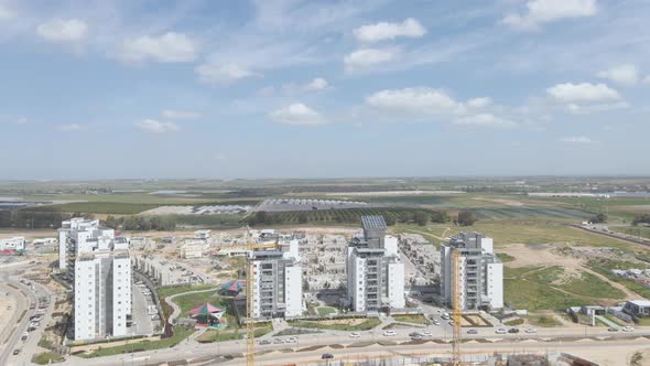 new neighborhood buildings with cranes at southern district city netivot