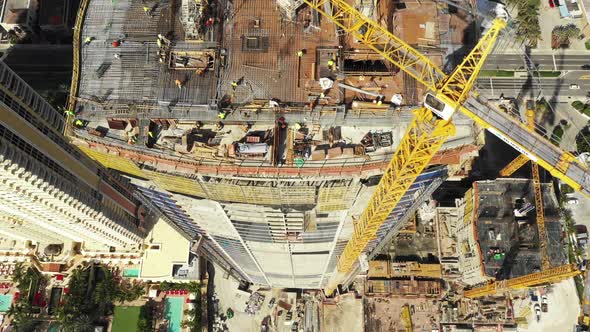 Cinematic epic shot of cranes over a construction site drone video