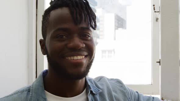 Portrait of a man at home smiling