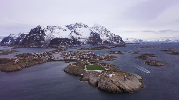 Henningsvaer Village and Mountains in Winter. Lofoten, Norway. Aerial View