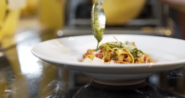 Chef Decorates the Pasta with Sauce