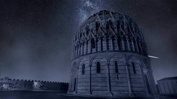 Milky way over monuments in Pisa at night, Italy, timelapse