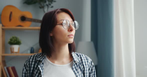 Slow Motion Portrait of Cheerful Girl Turning Head Looking at Camera Smiling