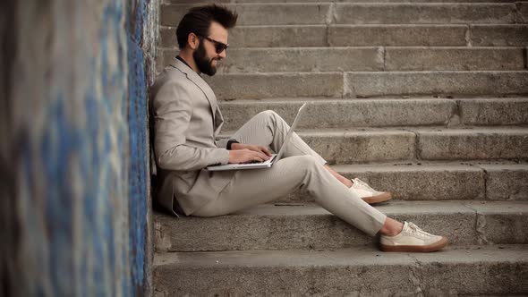 Man Sitting And Typing On Laptop. Businessman Remote Working In Internet Distance Job