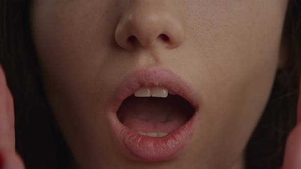 Close Up of a Mouth and Woman Hands in a Wow or Shock Emotion Expression Gesture