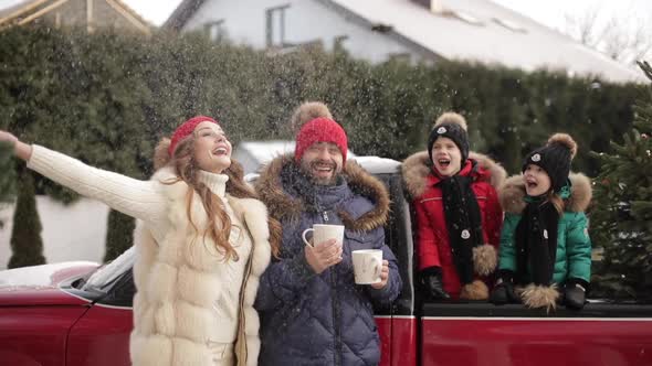 Happy Young Parents Standing Near Red Car Their Kids Outdoors