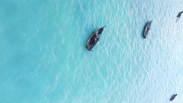 Vertical Video Boats in the Ocean Near the Coast of Zanzibar Tanzania Aerial View