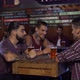 Guys chatting and laughing while drinking a beer in a bar in Patagonia Argentina - VideoHive Item for Sale