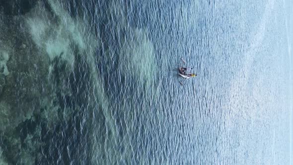 Tanzania Vertical Video  Boat Boats in the Ocean Near the Coast of Zanzibar Aerial View