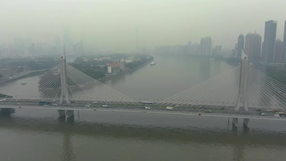 Bridge in Guangzhou City in Smog, Car Traffic and Cityscape. China. Aerial View