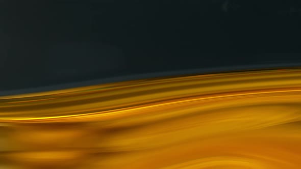 Super Slow Motion Shot of Moving Oil Waves Isolated on Black Background at 1000Fps alt