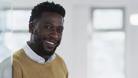 Portrait of man smiling in office