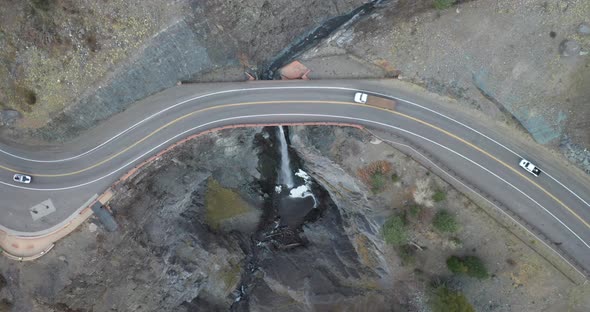 Overhead drone video shot of Million Dollar Highway in Colorado with vehicles driving.