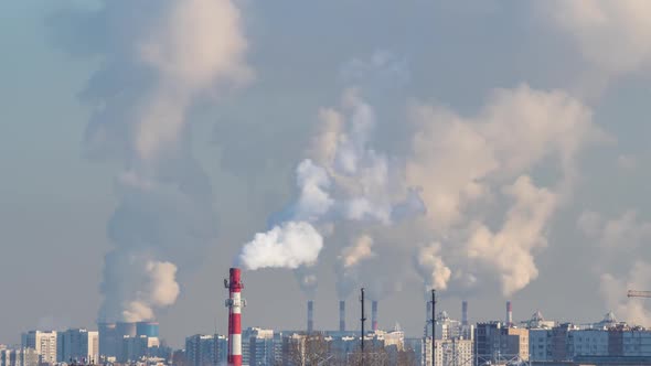 A lot of smoke from tubes above the city