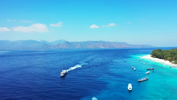 Aerial top down tourism of tranquil island beach time by blue ocean and white sandy background of a 