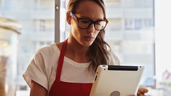 Waitress using digital tablet