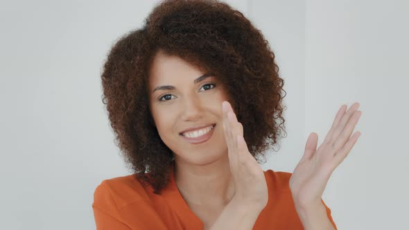African Woman Portrait Indoor Happy Grateful Biracial Cheerful Girl with Curly Hair Clapping Hands