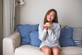 A young woman holding a plate of lemon pound cake at home - PhotoDune Item for Sale