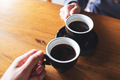 Closeup image of a man and a woman clinking coffee mugs in cafe - PhotoDune Item for Sale