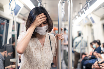 navirus outbreak by wear mask. Woman has fever and sore throat. Lady have a headache. Girl feel sick with high temperature.Covid-19 desease concept.
