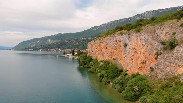 Aerial shot of Macedonia coast. Clif and beautiful water around Ohrid Lake in Southern Europe.