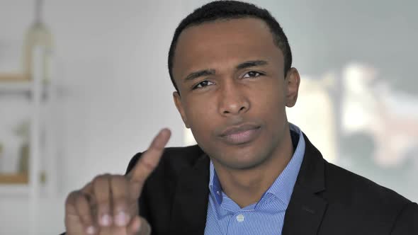 No Casual AfroAmerican Businessman Rejecting Offer By Waving Finger