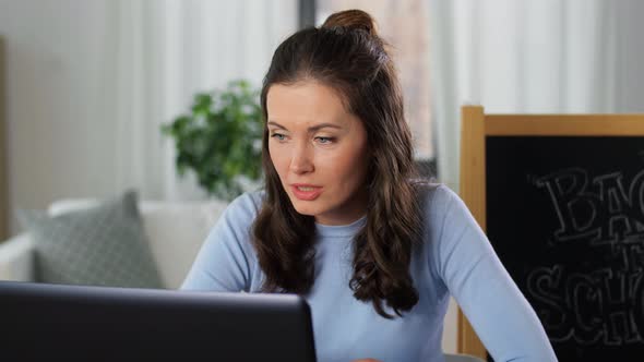 Teacher with Laptop Having Online Class at Home