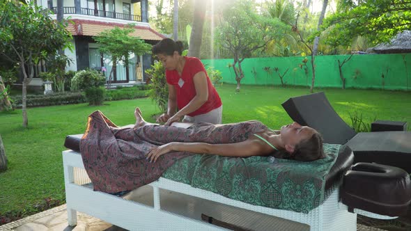 Woman Doing Massage to Girl in Asia