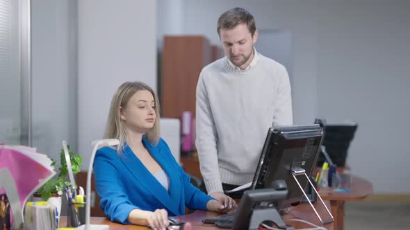 Arrogant Rude Young Woman Ignoring Man in Office