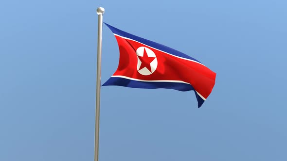 North Korean flag on flagpole.