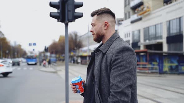 Handsome man on urban background. Profile of a young businessman