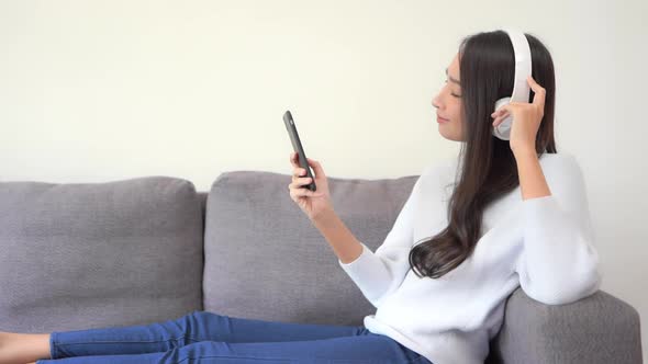 Woman use smart phone for listen music