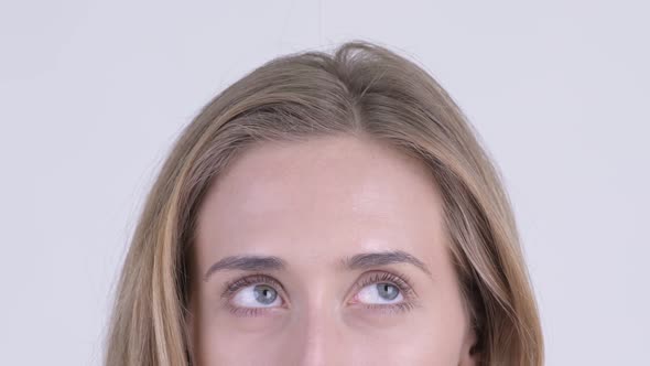 Eyes of Young Woman with Blond Hair Thinking