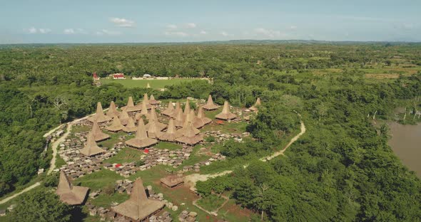 Indonesia Tropic Countryside Village Traditional Houses Animal Barns at Green Forest Aerial View