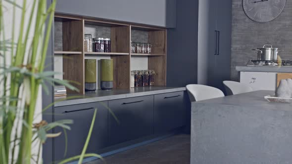 Tracking shot of a luxury kitchen with gray modern design