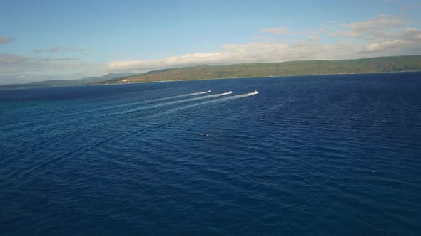 Aerial View on Three Boats Sailing on Blue Tropical Sea Near Coast of Exotic Island