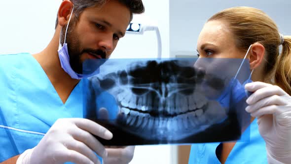 Dentists having discussion on x-ray