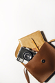 top view of vintage camera with notepad and bag on white background - PhotoDune Item for Sale