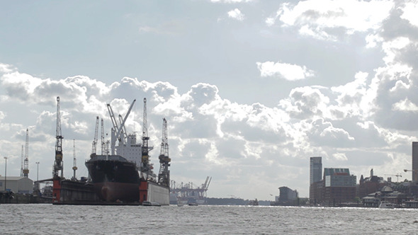 Cargo Ship In Hamburg Port Bright Clouds