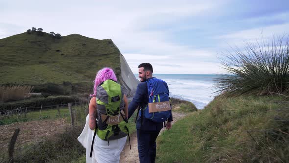 Slow motion shot of bridal couple walking to viewpoint