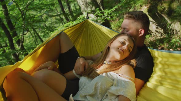 Couple relaxing in a hammock