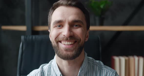 Close Up Face of Smiling Bearded Professional Businessman Looking at Camera