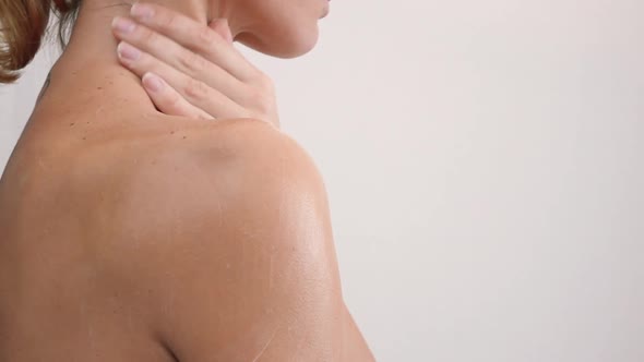 Shoulder and Woman Back Body Lotion Spreading Slow Motion Closeup