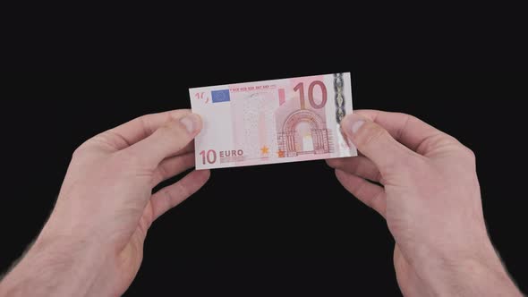 Male Hands Show a Banknote of 10 Euro with Alpha Channel