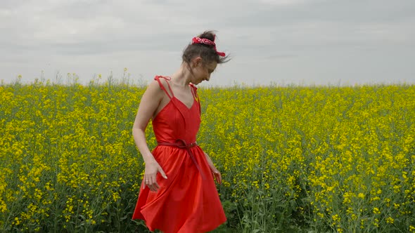 Young Sexy Woman in Red Dress Dancing