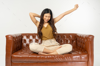 � smiling teenage girl sitting on sofa with tablet .office synonym concept.time relax from work hard