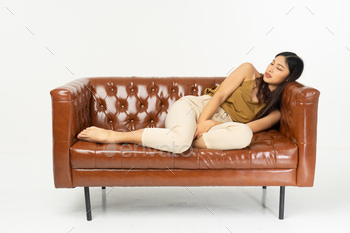 � smiling teenage girl sitting on sofa with tablet .office synonym concept.