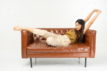 � smiling teenage girl sitting on sofa with tablet .office synonym concept.