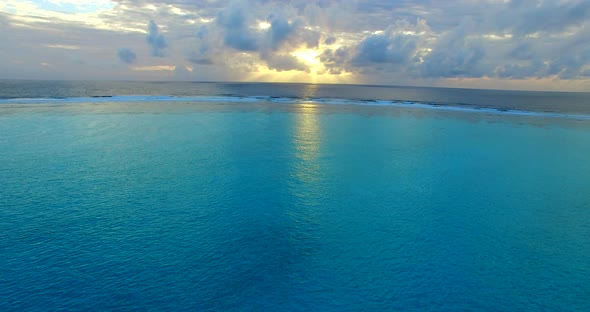 Tropical aerial abstract view of a sunshine white sandy paradise beach and blue sea background 