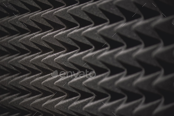 Musical background theme: grey soundproof coverage in recording studio. Media production